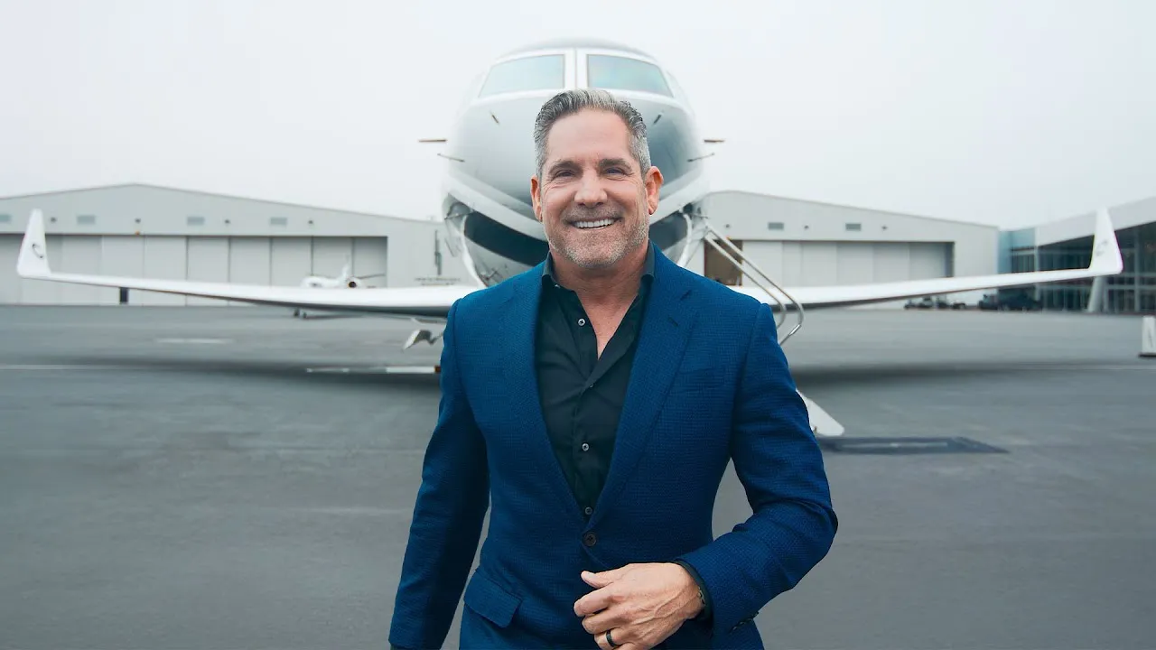 Picture of Grant Cardone infront of a private jet